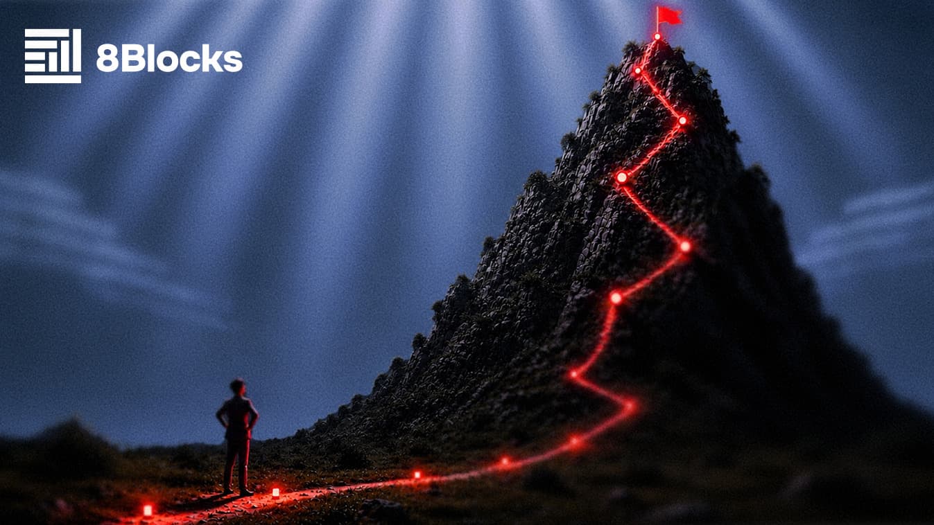 A lone figure looking up a mountain path lit by a red route to a summit flag, 8Blocks branding — the road to a successful token launch